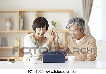 Stock Image - Japanese senior couple. Fotosearch