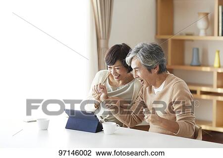 Stock Image - Japanese senior couple. Fotosearch