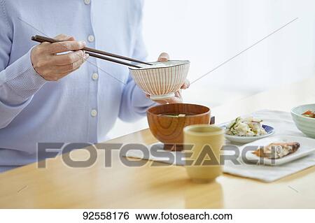 Japanese senior woman eating View Large Photo Image Stock Photograph - Japanese senior woman eating. Fotosearch