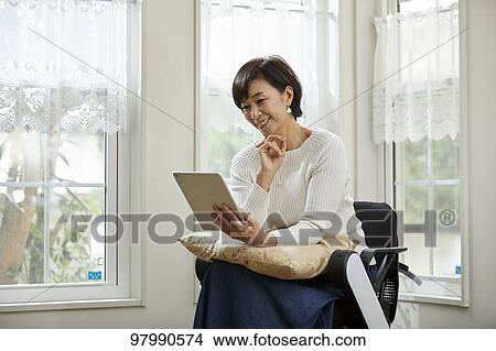 Japanese senior woman on electric wheelchair View Large Photo Image Picture - Japanese senior woman on electric wheelchair. Fotosearch