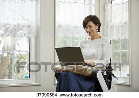 Japanese senior woman on electric wheelchair View Large Photo Image Picture - Japanese senior woman on electric wheelchair. Fotosearch