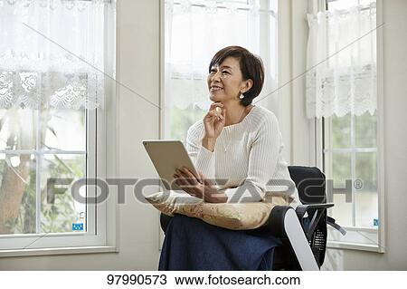 Japanese senior woman on electric wheelchair View Large Photo Image Stock Image - Japanese senior woman on electric wheelchair. Fotosearch