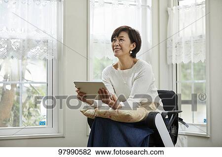 Japanese senior woman on electric wheelchair View Large Photo Image Stock Image - Japanese senior woman on electric wheelchair. Fotosearch
