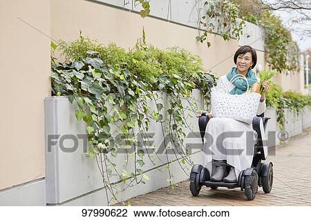 Japanese senior woman on electric wheelchair View Large Photo Image Stock Image - Japanese senior woman on electric wheelchair. Fotosearch