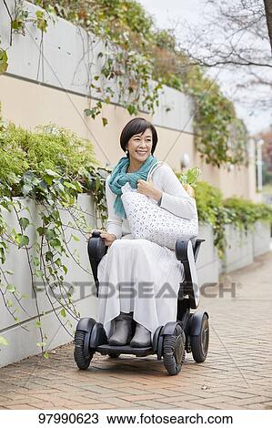 Japanese senior woman on electric wheelchair View Large Photo Image Stock Image - Japanese senior woman on electric wheelchair. Fotosearch