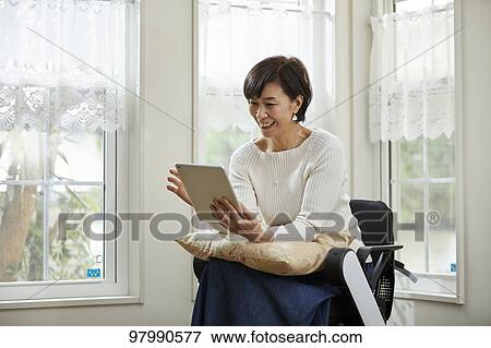 Japanese senior woman on electric wheelchair View Large Photo Image Stock Photo - Japanese senior woman on electric wheelchair. Fotosearch