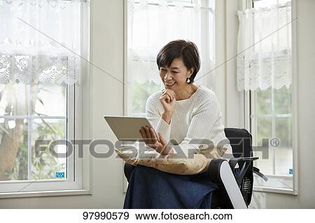 Japanese senior woman on electric wheelchair View Large Photo Image Stock Photo - Japanese senior woman on electric wheelchair. Fotosearch