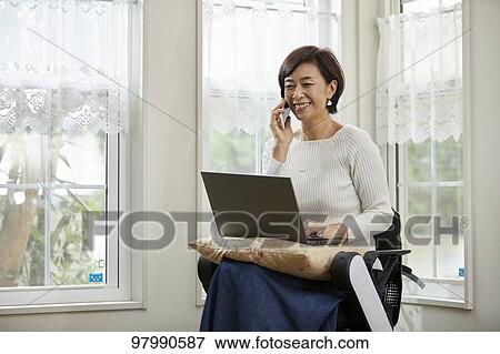 Japanese senior woman on electric wheelchair View Large Photo Image Stock Photo - Japanese senior woman on electric wheelchair. Fotosearch