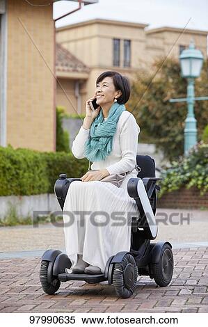 Japanese senior woman on electric wheelchair View Large Photo Image Stock Photography - Japanese senior woman on electric wheelchair. Fotosearch