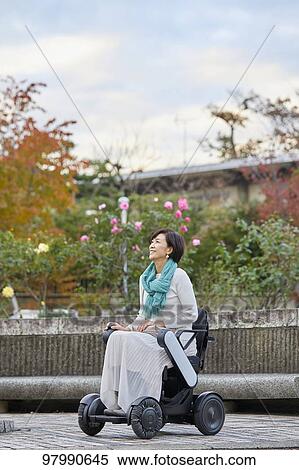 Japanese senior woman on electric wheelchair View Large Photo Image Stock Photography - Japanese senior woman on electric wheelchair. Fotosearch