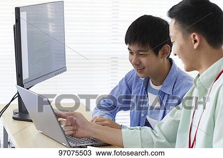 Japanese teenager studying programming View Large Photo Image Stock Image - Japanese teenager studying programming. Fotosearch