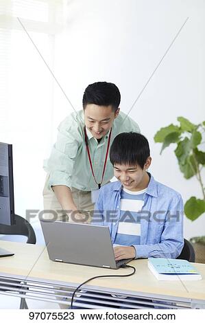 Japanese teenager studying programming View Large Photo Image Stock Image - Japanese teenager studying programming. Fotosearch