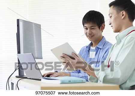 Japanese teenager studying programming View Large Photo Image Stock Photo - Japanese teenager studying programming. Fotosearch
