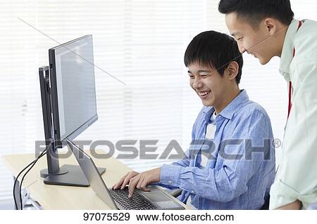 Japanese teenager studying programming View Large Photo Image Stock Photo - Japanese teenager studying programming. Fotosearch
