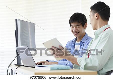 Japanese teenager studying programming View Large Photo Image Stock Photograph - Japanese teenager studying programming. Fotosearch
