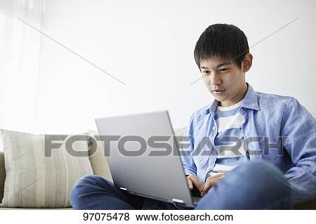 Japanese teenager with laptop View Large Photo Image Stock Photo - Japanese teenager with laptop. Fotosearch