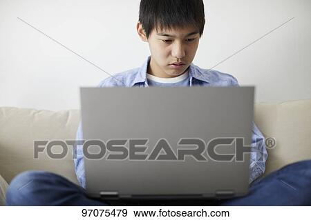Japanese teenager with laptop View Large Photo Image Stock Photo - Japanese teenager with laptop. Fotosearch