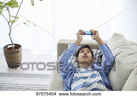 Japanese teenager with smartphone View Large Photo Image Picture - Japanese teenager with smartphone. Fotosearch