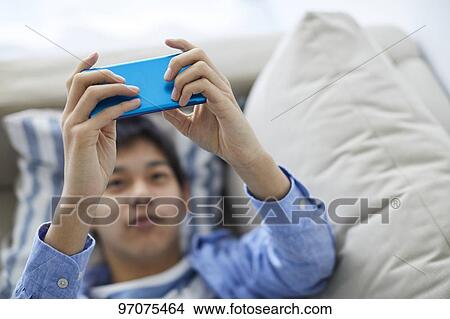 Japanese teenager with smartphone View Large Photo Image Picture - Japanese teenager with smartphone. Fotosearch