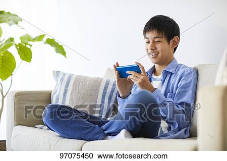 Japanese teenager with smartphone View Large Photo Image Stock Image - Japanese teenager with smartphone. Fotosearch