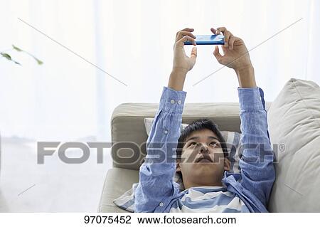 Japanese teenager with smartphone View Large Photo Image Stock Image - Japanese teenager with smartphone. Fotosearch