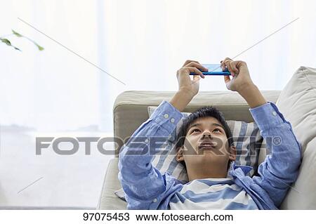 Japanese teenager with smartphone View Large Photo Image Stock Image - Japanese teenager with smartphone. Fotosearch