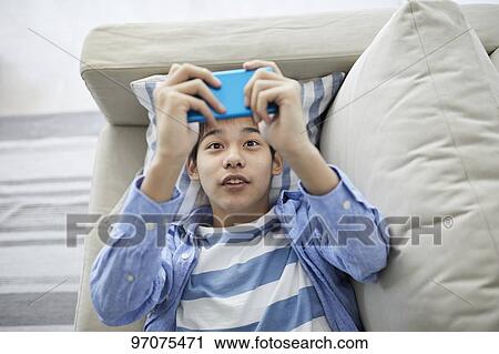 Japanese teenager with smartphone View Large Photo Image Stock Image - Japanese teenager with smartphone. Fotosearch