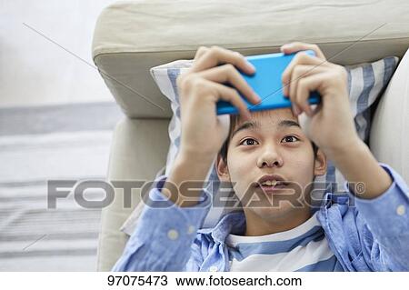Japanese teenager with smartphone View Large Photo Image Stock Image - Japanese teenager with smartphone. Fotosearch