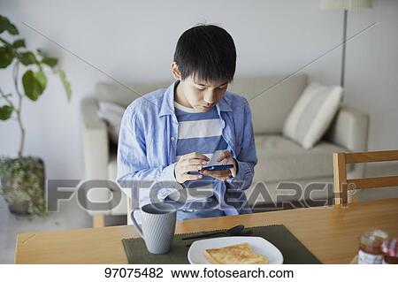 Japanese teenager with smartphone View Large Photo Image Stock Image - Japanese teenager with smartphone. Fotosearch