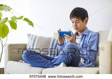 Japanese teenager with smartphone View Large Photo Image Stock Photo - Japanese teenager with smartphone. Fotosearch
