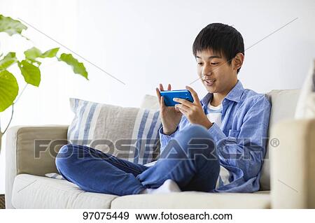 Japanese teenager with smartphone View Large Photo Image Stock Photo - Japanese teenager with smartphone. Fotosearch