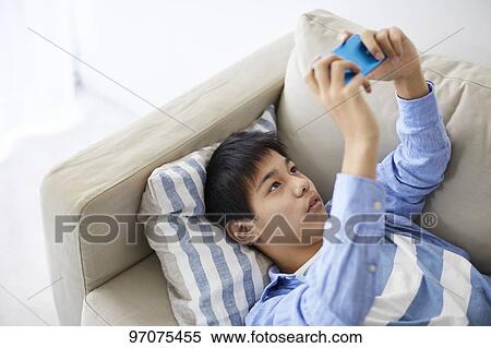 Japanese teenager with smartphone View Large Photo Image Stock Photography - Japanese teenager with smartphone. Fotosearch