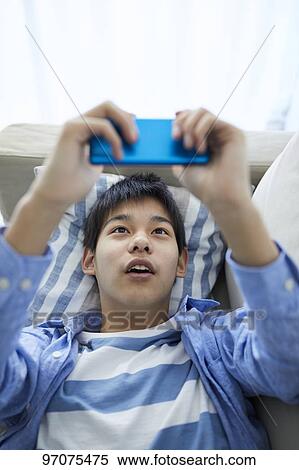 Japanese teenager with smartphone View Large Photo Image Stock Photography - Japanese teenager with smartphone. Fotosearch