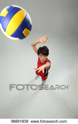 Stock Photo - Japanese volley player in the studio. Fotosearch