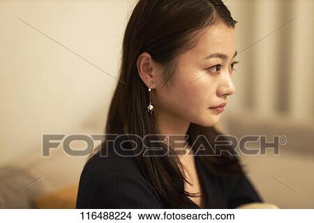 Picture - Japanese woman at home. Fotosearch