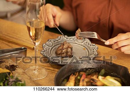 Japanese woman dining View Large Photo Image Picture - Japanese woman dining. Fotosearch