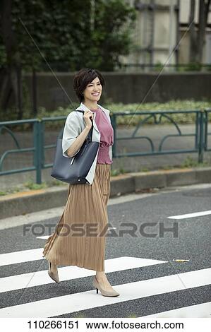Japanese woman downtown View Large Photo Image Stock Image - Japanese woman downtown. Fotosearch