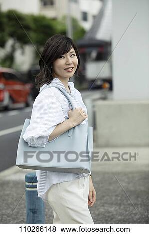 Japanese woman downtown View Large Photo Image Stock Photo - Japanese woman downtown. Fotosearch