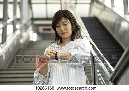 Stock Photo - Japanese woman downtown. Fotosearch