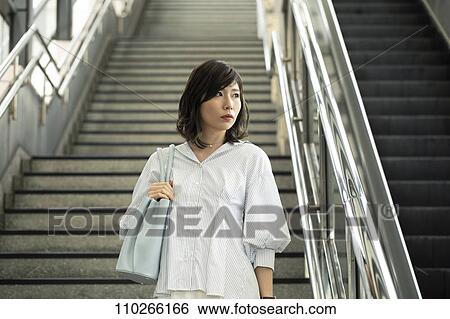 Japanese woman downtown View Large Photo Image Stock Photograph - Japanese woman downtown. Fotosearch