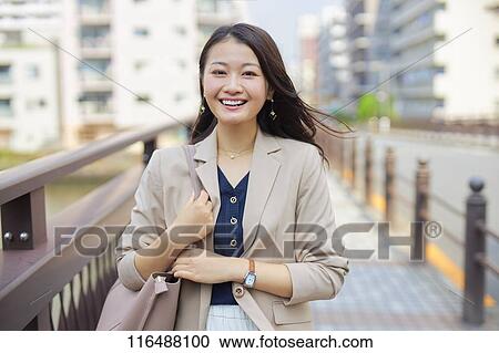 Japanese woman downtown Tokyo View Large Photo Image Stock Image - Japanese woman downtown Tokyo. Fotosearch