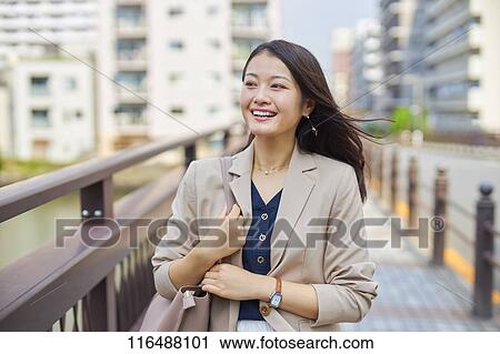 Japanese woman downtown Tokyo View Large Photo Image Stock Image - Japanese woman downtown Tokyo. Fotosearch