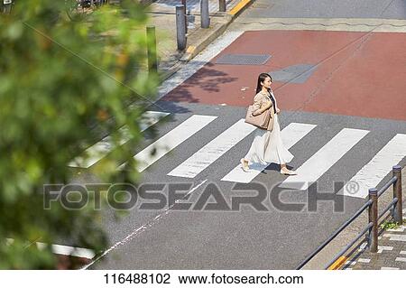Japanese woman downtown Tokyo View Large Photo Image Stock Image - Japanese woman downtown Tokyo. Fotosearch