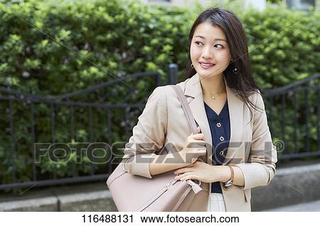 Japanese woman downtown Tokyo View Large Photo Image Stock Image - Japanese woman downtown Tokyo. Fotosearch