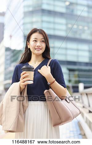 Stock Photo - Japanese woman downtown Tokyo. Fotosearch