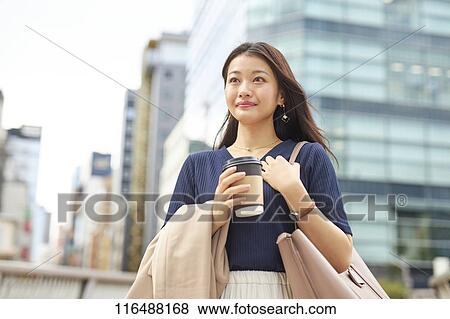 Japanese woman downtown Tokyo View Large Photo Image Stock Photo - Japanese woman downtown Tokyo. Fotosearch