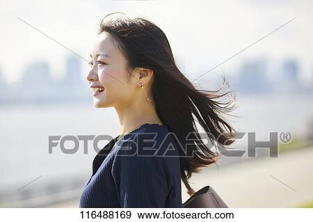 Stock Photo - Japanese woman downtown Tokyo. Fotosearch