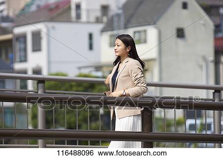 Stock Photograph - Japanese woman downtown Tokyo. Fotosearch