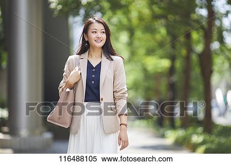 Stock Photography - Japanese woman downtown Tokyo. Fotosearch