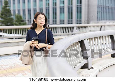 Stock Photography - Japanese woman downtown Tokyo. Fotosearch